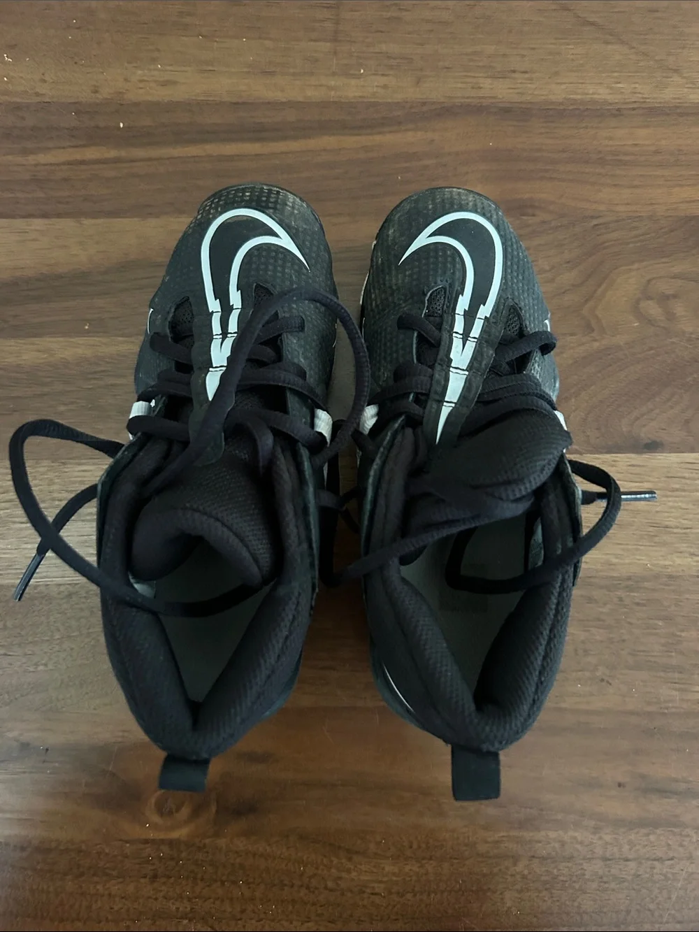 Nike Alpha Kids Black cleats with White Swoosh